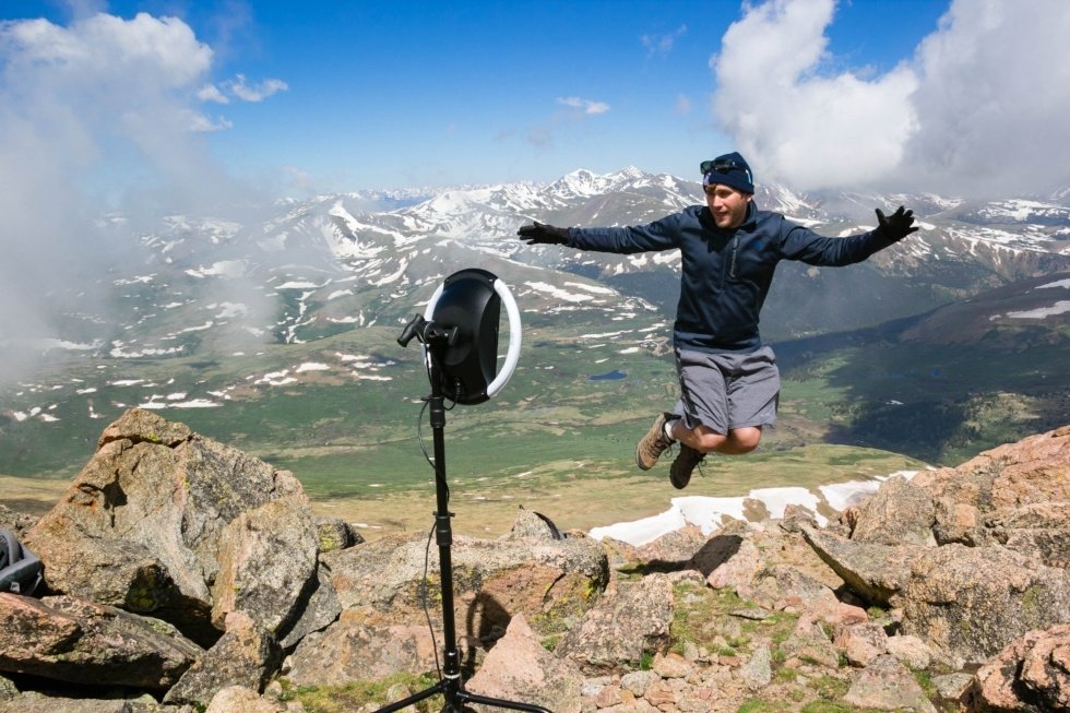 Man jumping on mountain next to HALO