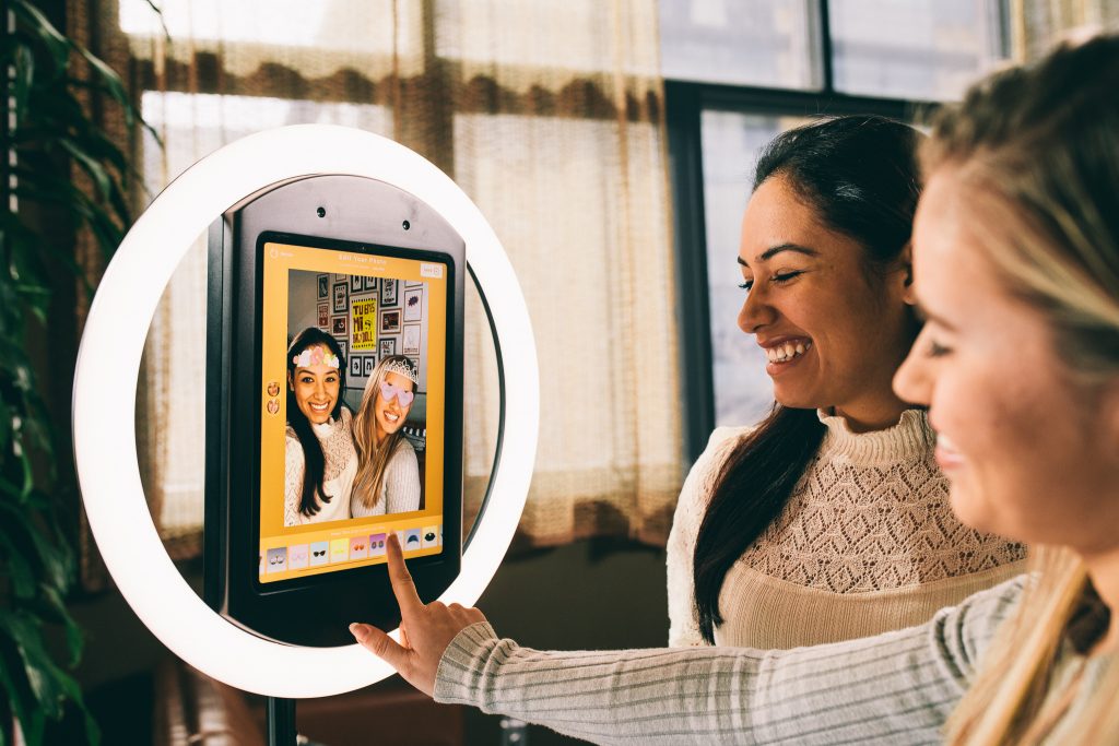 2 Girls Select Digital Props on Selfie Kiosk