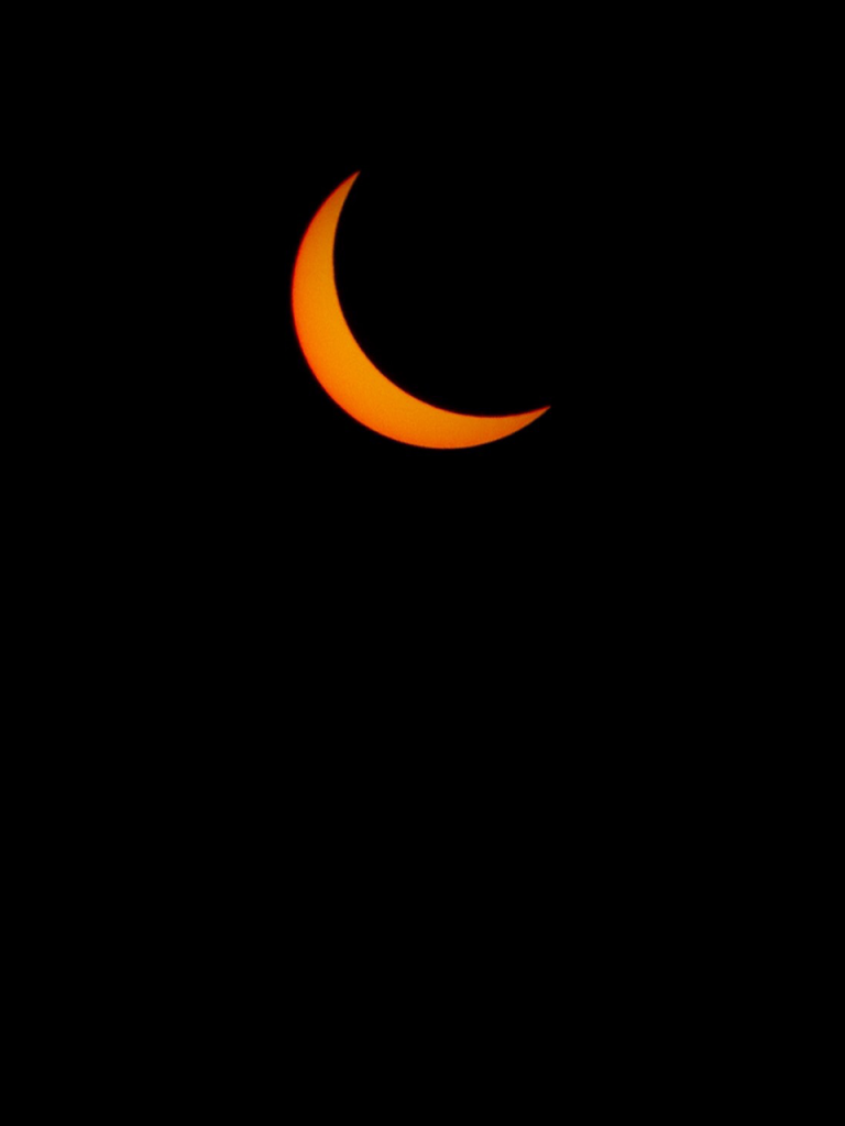 black background with orange crescent moon