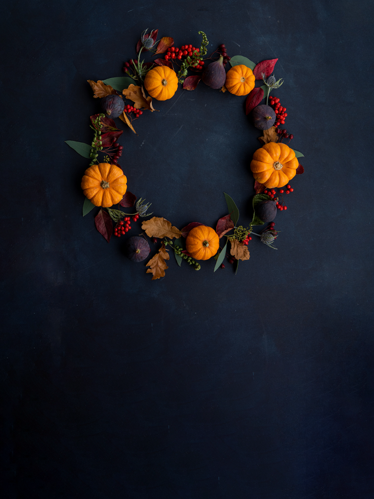 halloween wreath on black chalkboard photobooth background