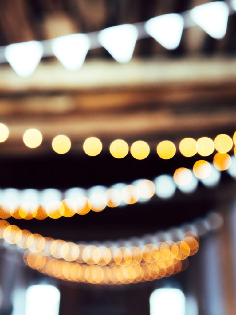 rows of string lights blurry photo booth background