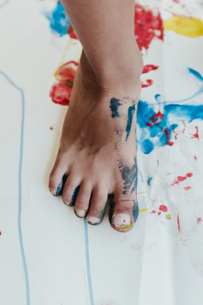 kids foot with paint on it