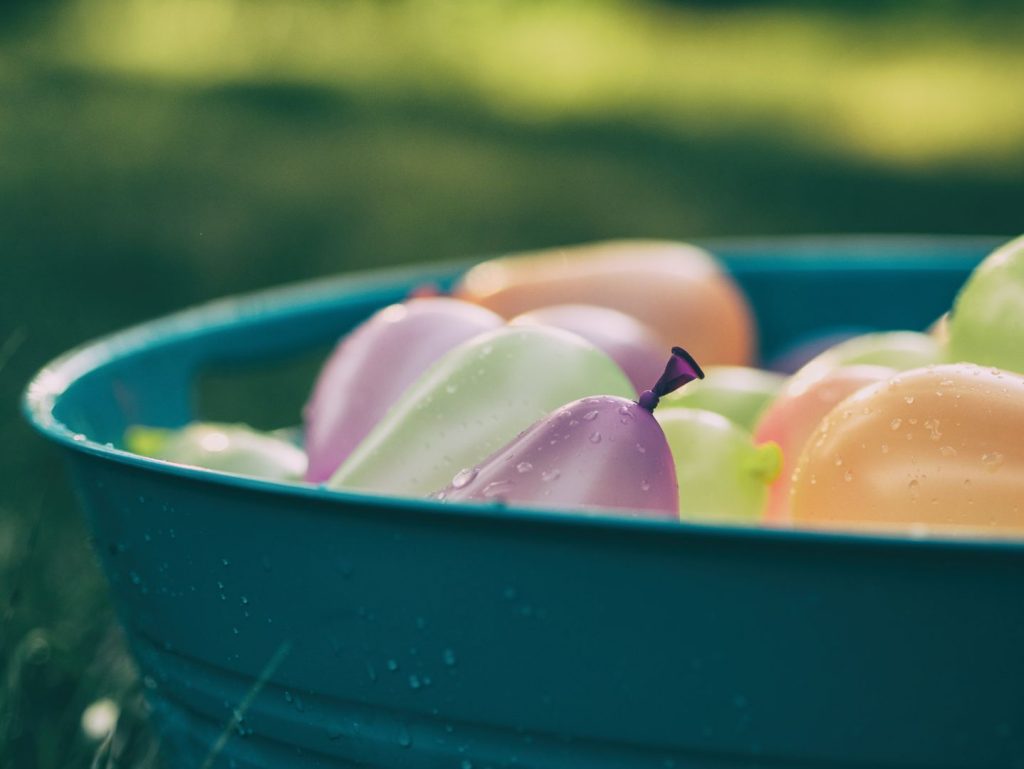 bucket of water balloons for kids to play with at home