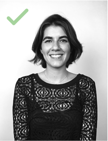 Woman smiling with green checkmark in corner