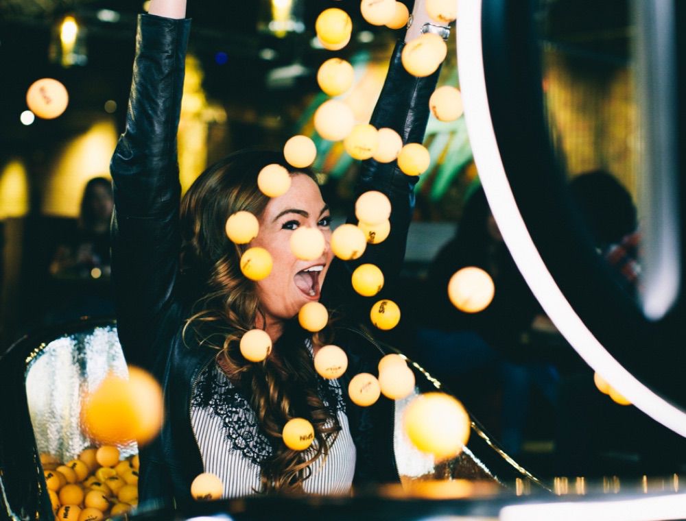 Woman installing HALO in an event space